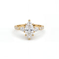 Marquise Lab-Grown Diamond three-stone engagement ring with pear-shaped side stones in 14K yellow gold, front view — Black Pearl of Queens