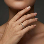 Marquise and round lab grown diamond wedding band in 14K yellow gold worn on hand