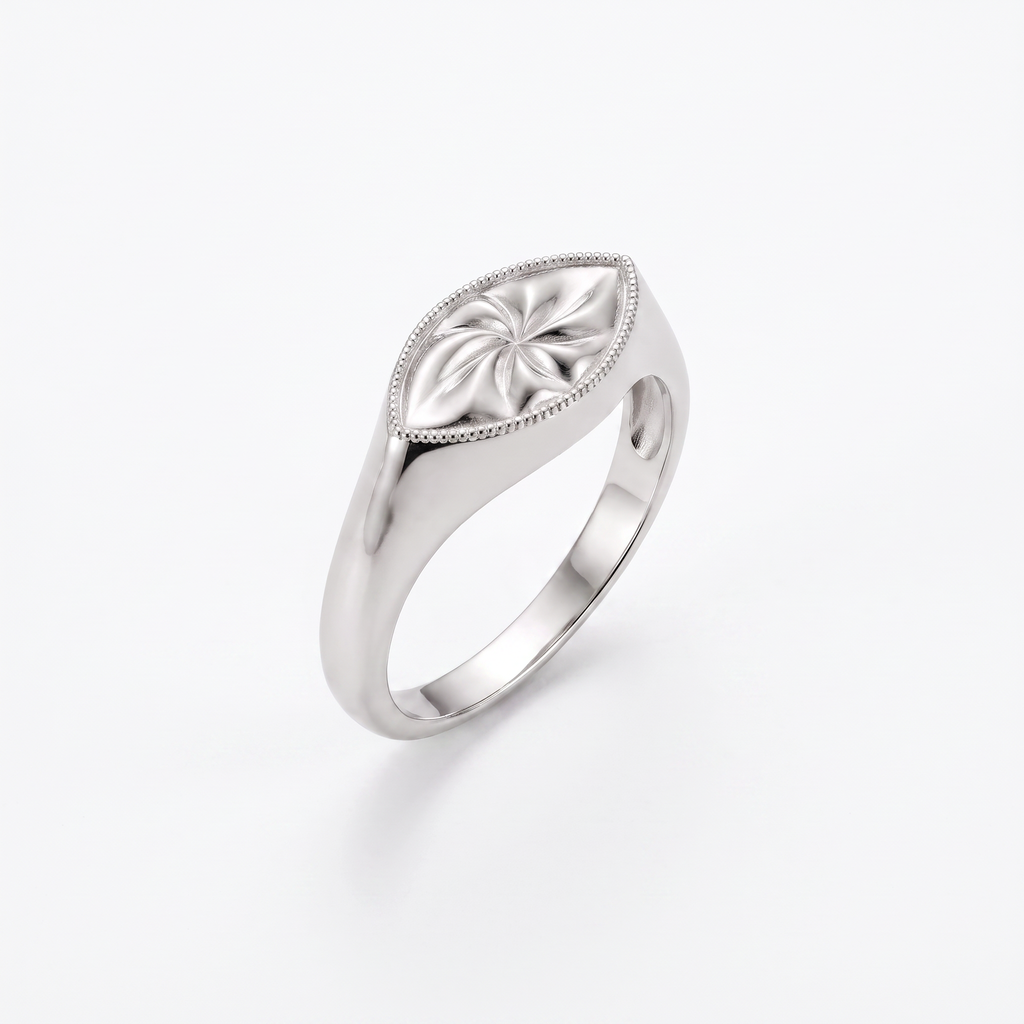Hand-engraved marquise signet ring in solid 14K rose gold with a pinwheel motif and milgrain border