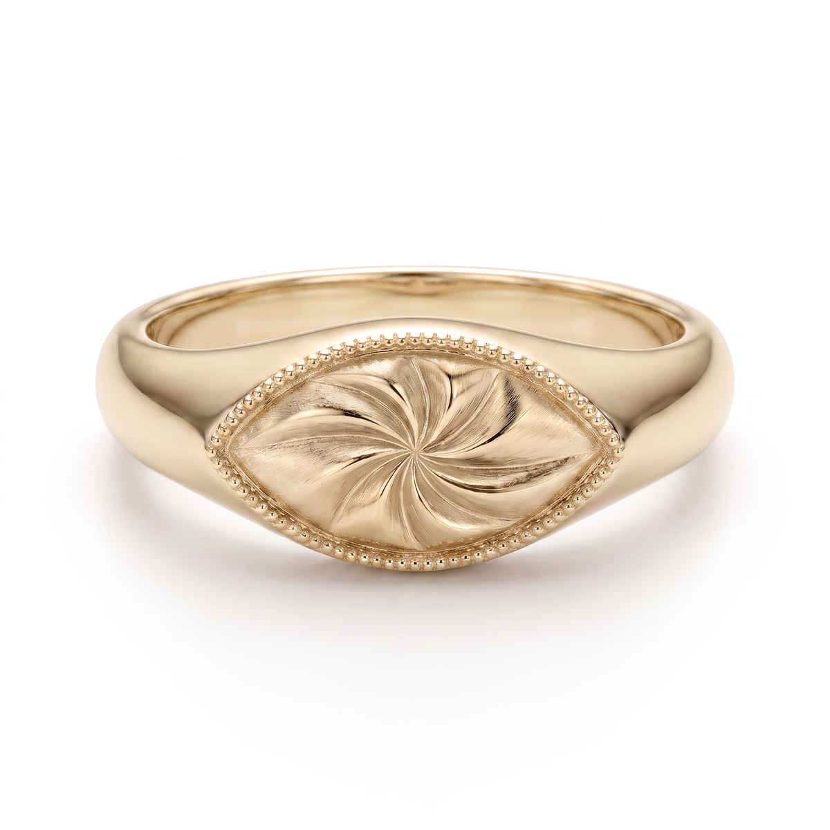 Hand-engraved marquise signet ring in solid 14K yellow gold with a pinwheel motif and milgrain border