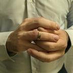 Greek key ring wedding band on man’s hand, dress shirt