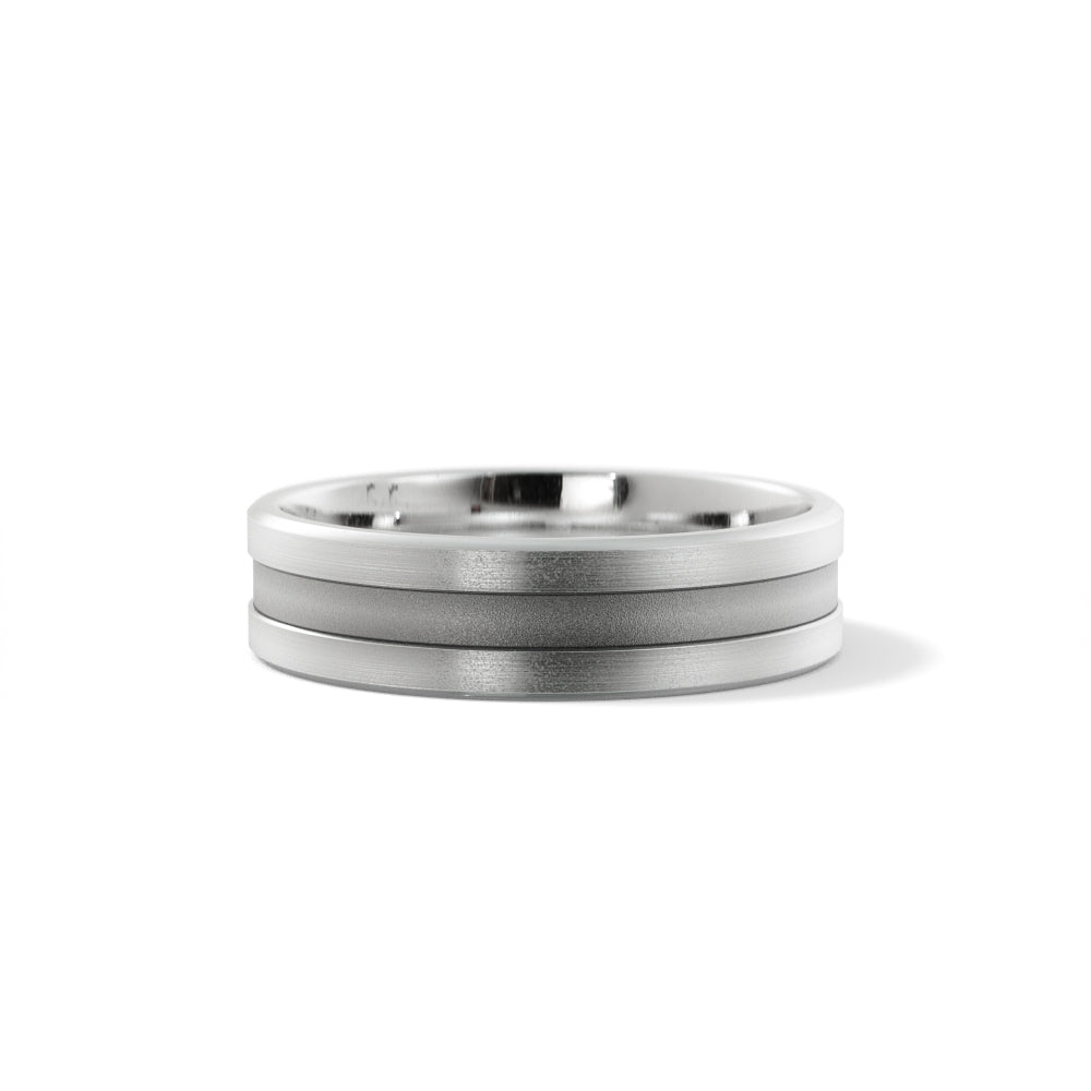 Men's 6mm grooved wedding band in 14K white gold, sandblasted center between brushed rails with polished beveled edges, front view