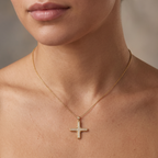 Man wearing the rope Greek cross pendant in 14K yellow gold with an open collar shirt