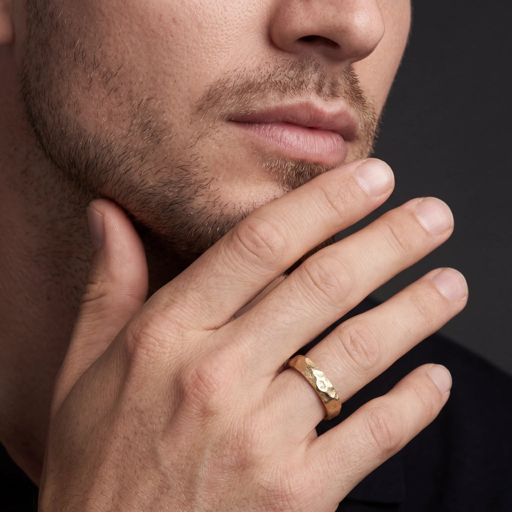 Men's Rustic Hammered Wedding Band in 14K gold, angled view showing the organic hammered texture