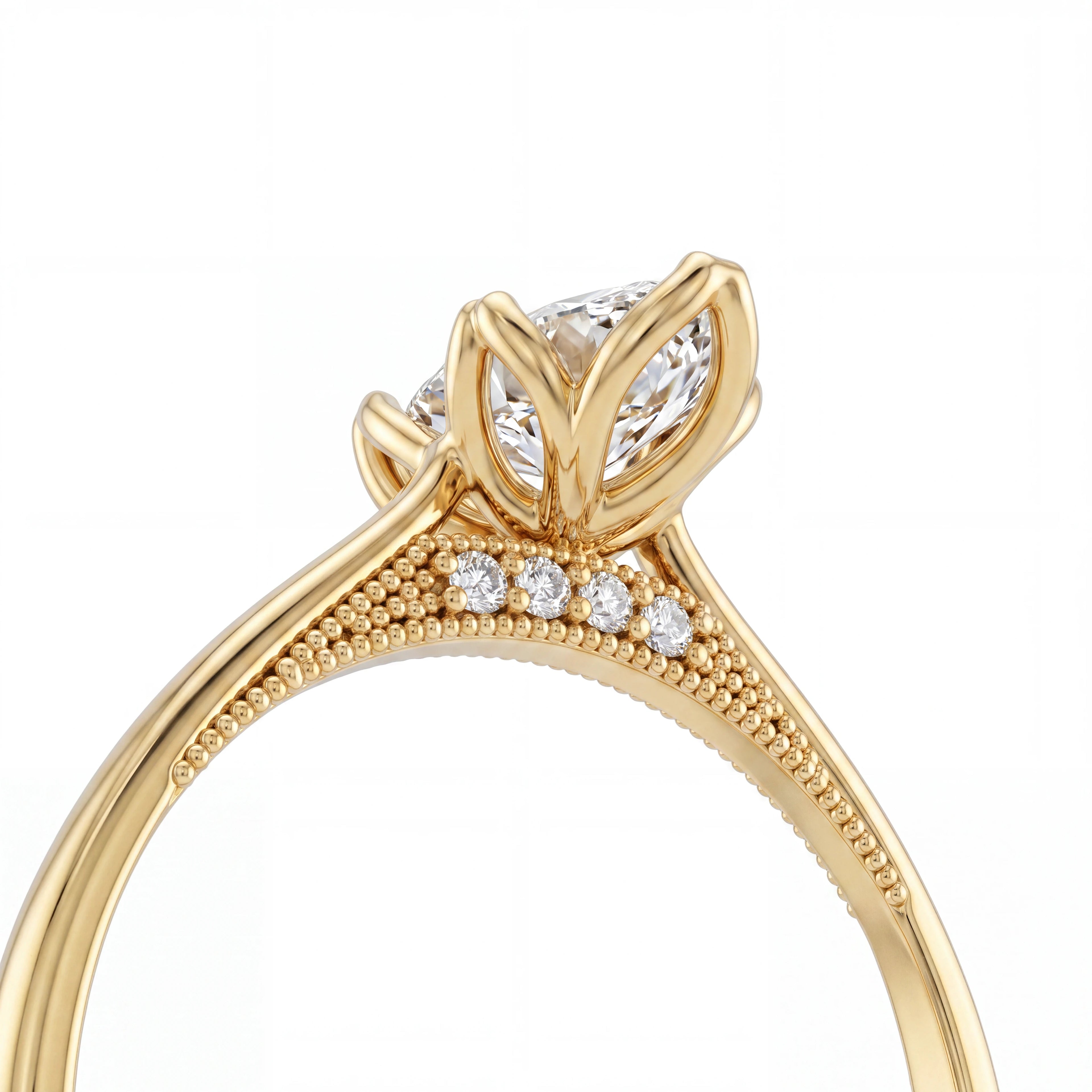 Close-up of gallery diamond and milgrain detail on marquise vintage-inspired engagement ring, 14K yellow gold