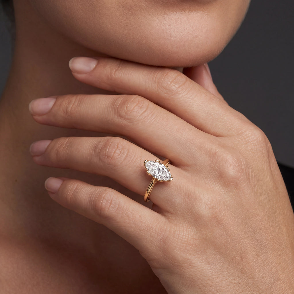 Vintage-inspired 1ct Lab-Grown Diamond marquise engagement ring in 14K yellow gold, worn on hand