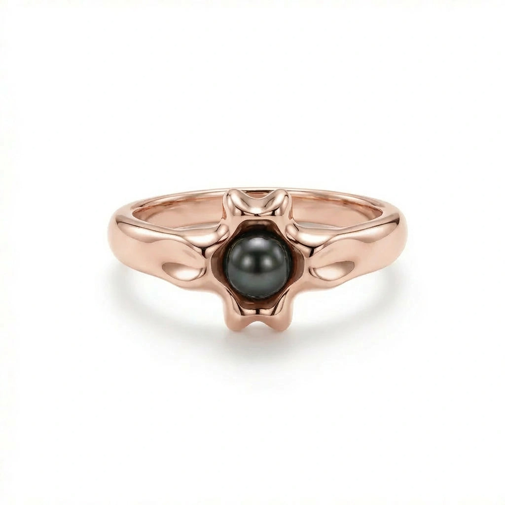Noir Astra Black Pearl Ring in solid 14K rose gold, black pearl centerpiece with sculptural starburst design