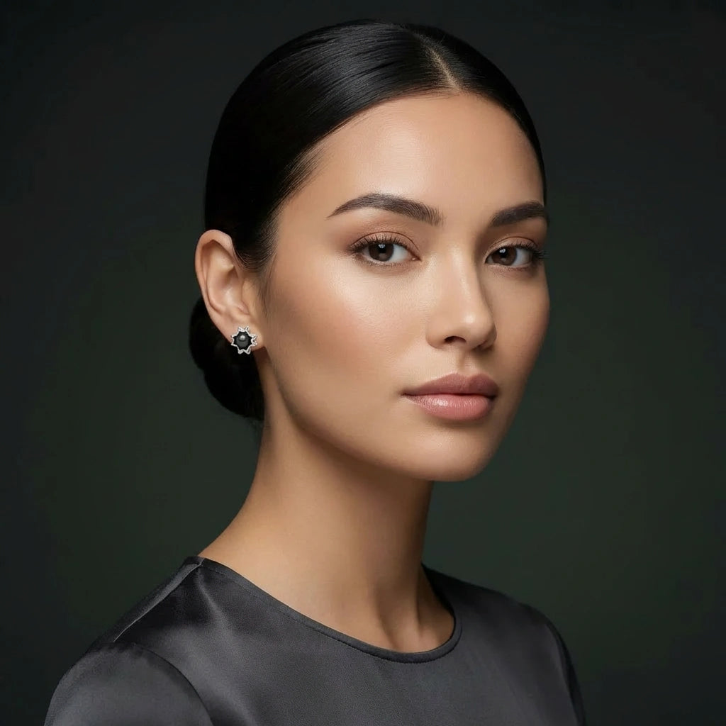 Noir Astra Black Pearl Stud Earrings in solid 14K white gold, black pearl starburst studs worn on model