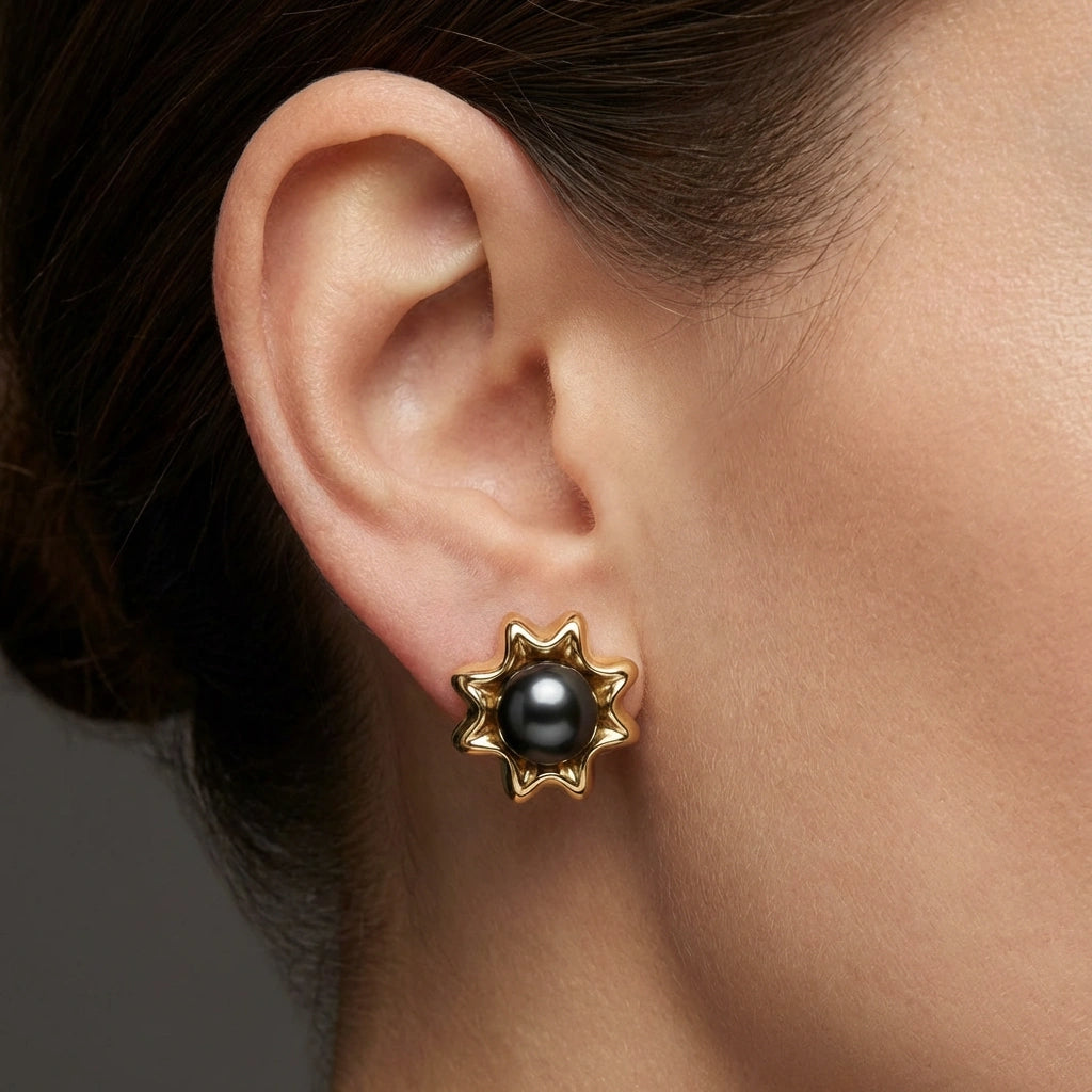 Noir Astra Black Pearl Stud Earrings in solid 14K yellow gold, black pearl studs worn on ear