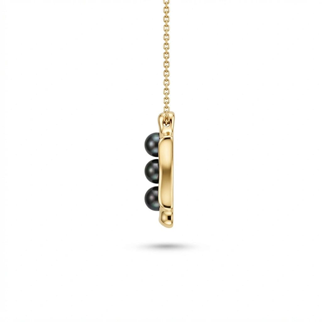 Noir Astra Trinity Black Pearl Pendant in solid 14K yellow gold, triple black pearl vertical design side view