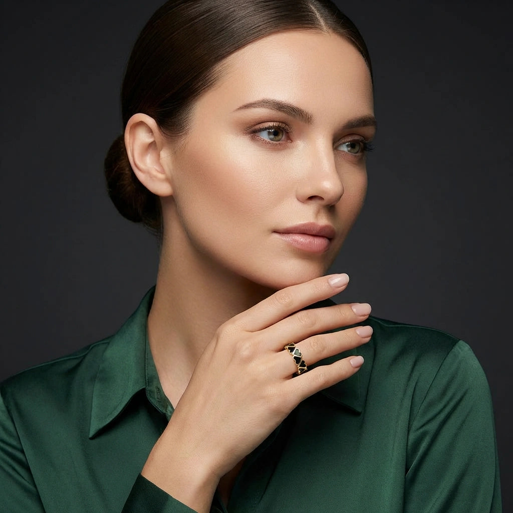 Model wearing 14K rose gold Noir Heart eternity band with black enamel hearts