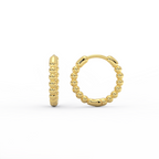 Orba Beaded Huggie Earrings in 14K gold side view showing hinged closure and beaded texture