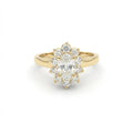 0.7ct oval diamond flower halo engagement ring in 14K yellow gold - top view showing petal-shaped halo detail