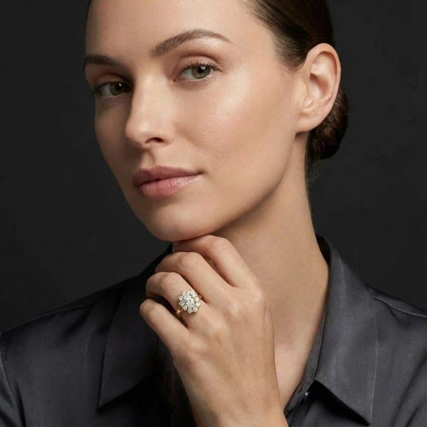 0.7ct oval diamond flower halo engagement ring in 14K yellow gold on woman hand- handcrafted NYC bridal jewelry