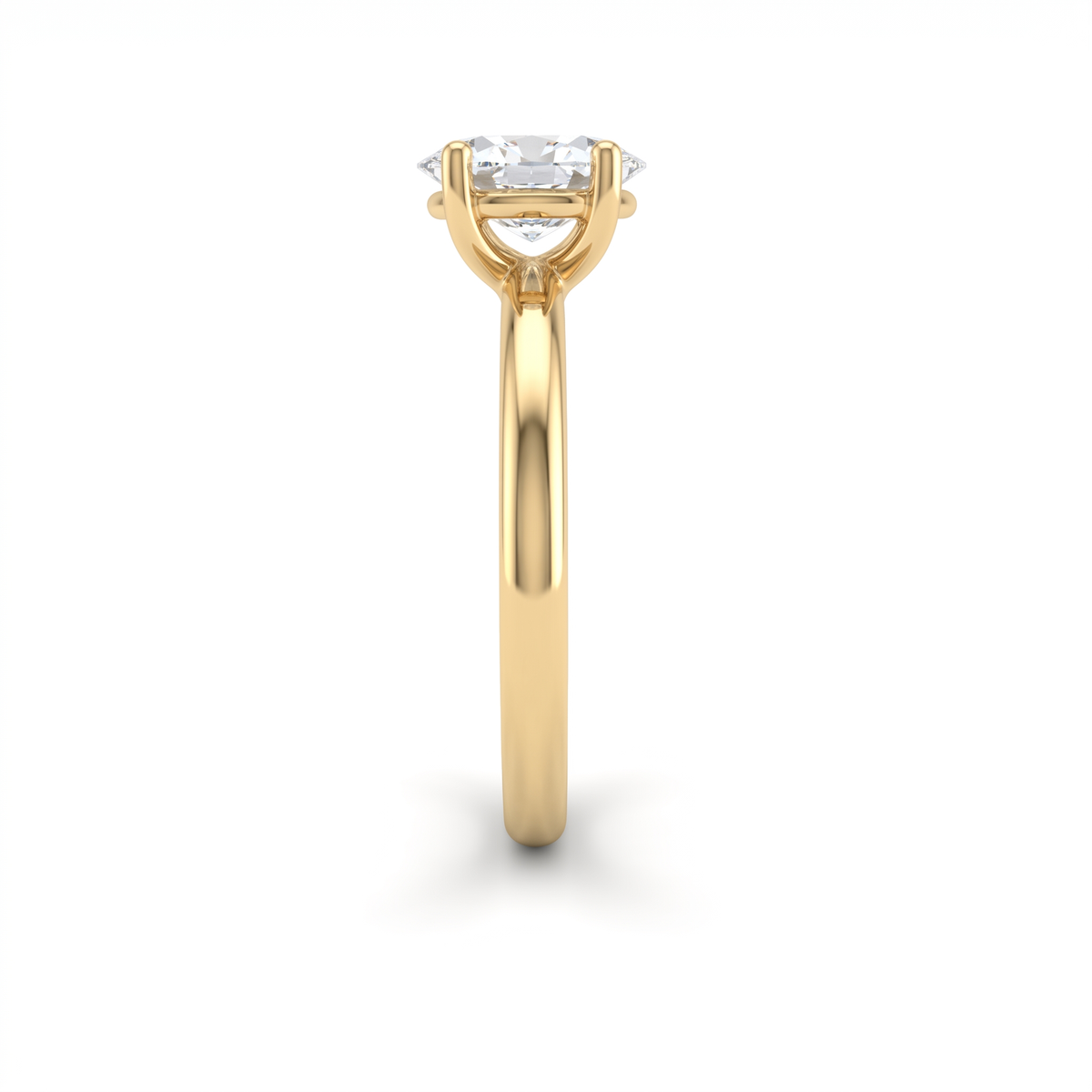 Side profile of the oval solitaire engagement ring in 14K yellow gold, showing the setting height and slim band