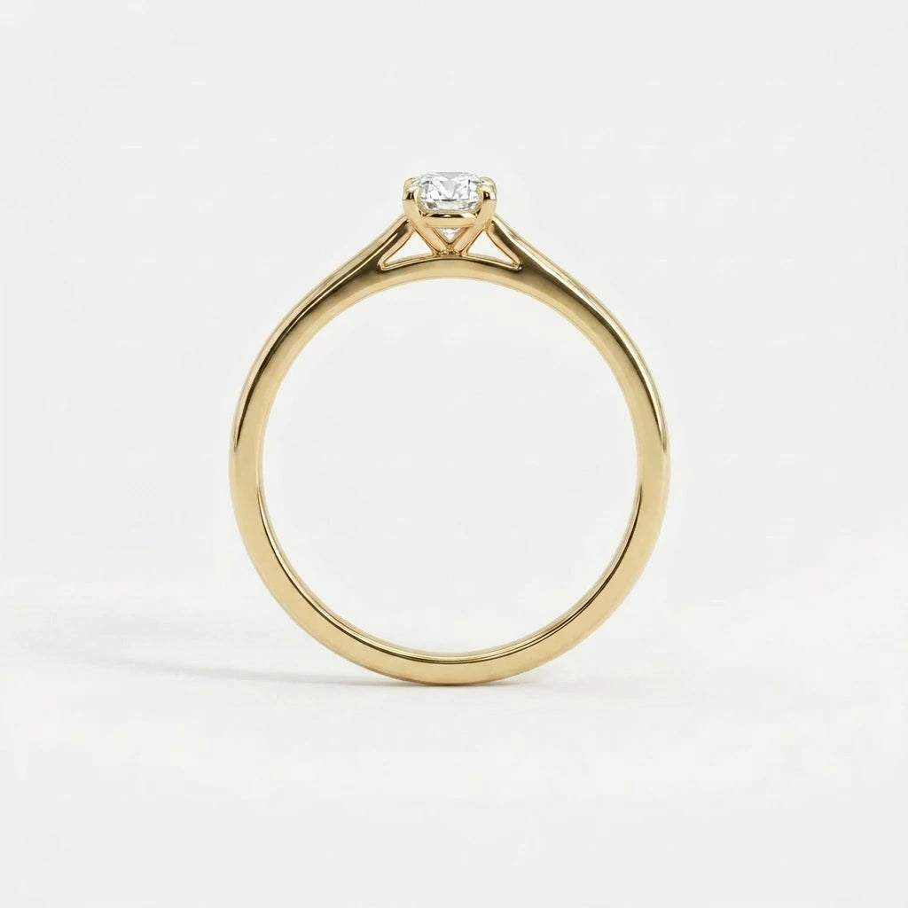 Side profile of oval solitaire ultra thin engagement ring in solid 14K yellow gold with lab-grown diamond