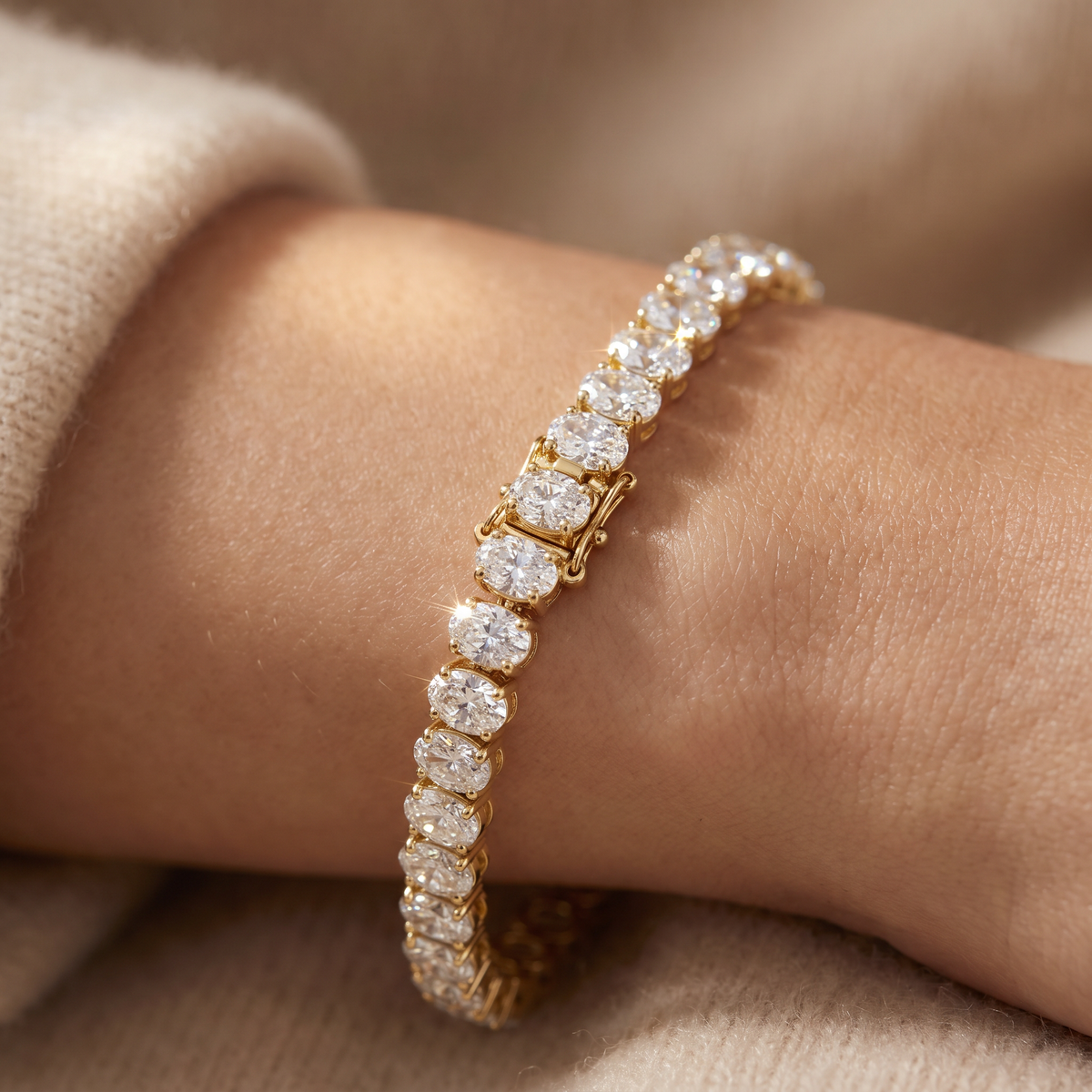 North-south oval tennis bracelet in 14K yellow gold with Lab-Grown Diamonds worn on the wrist