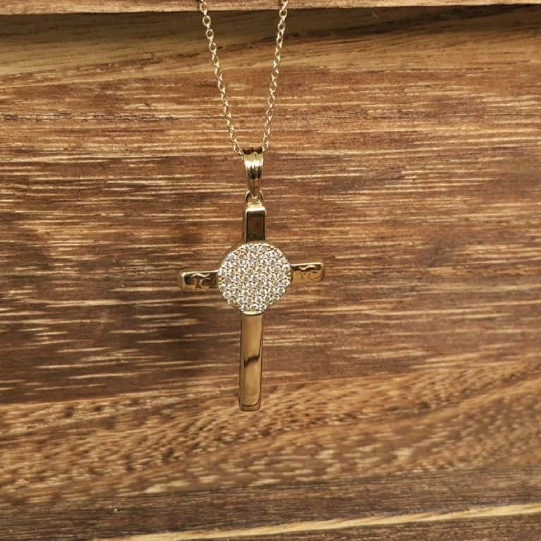 14K yellow gold cross pendant with round pave diamond center disc on cable chain.