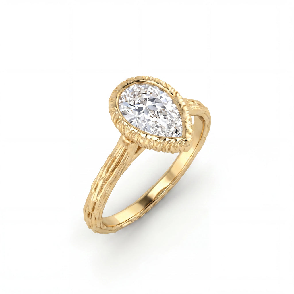 Pear Lab-Grown Diamond engagement ring with a hand-carved branch band in 14K yellow gold