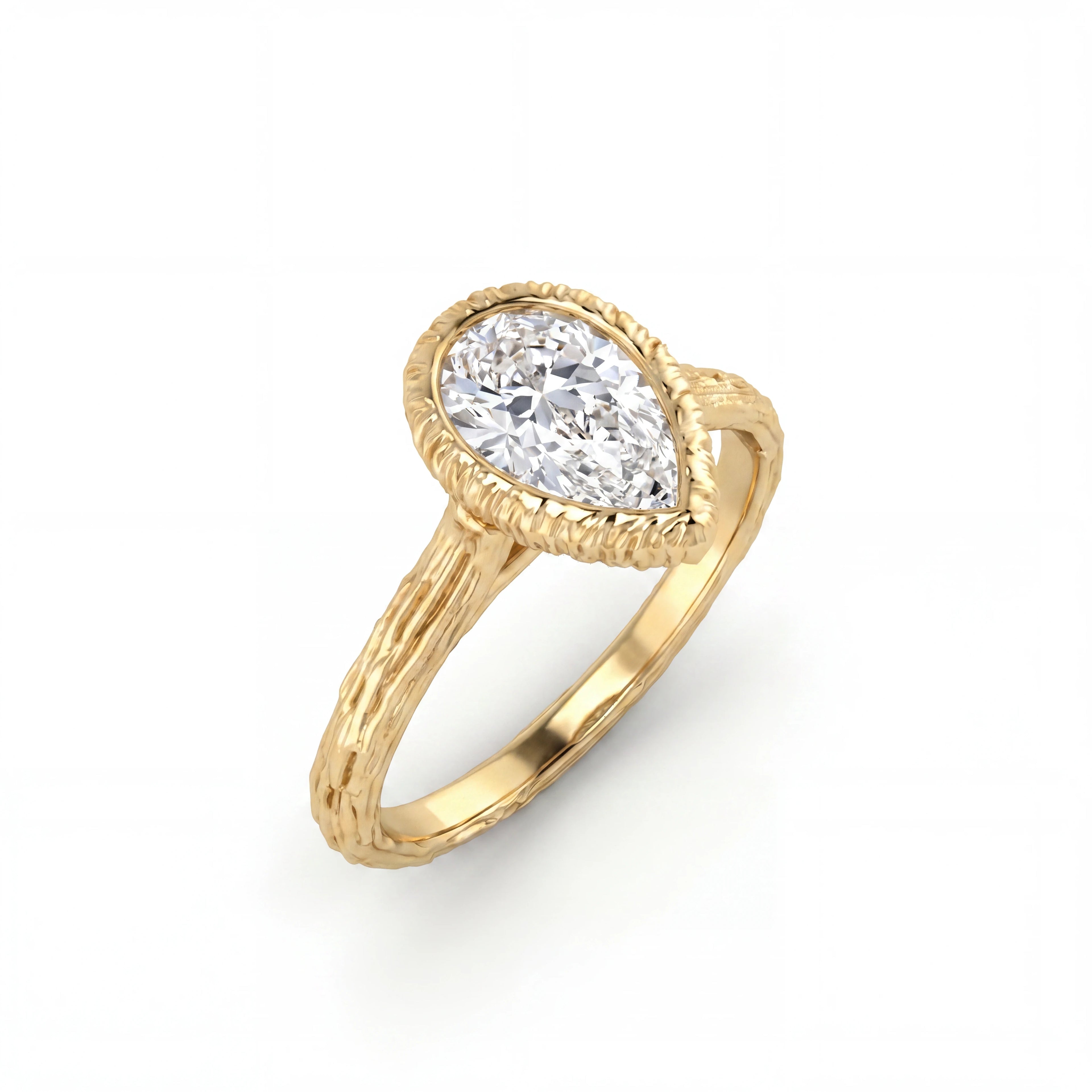 Pear Lab-Grown Diamond engagement ring with a hand-carved branch band in 14K yellow gold