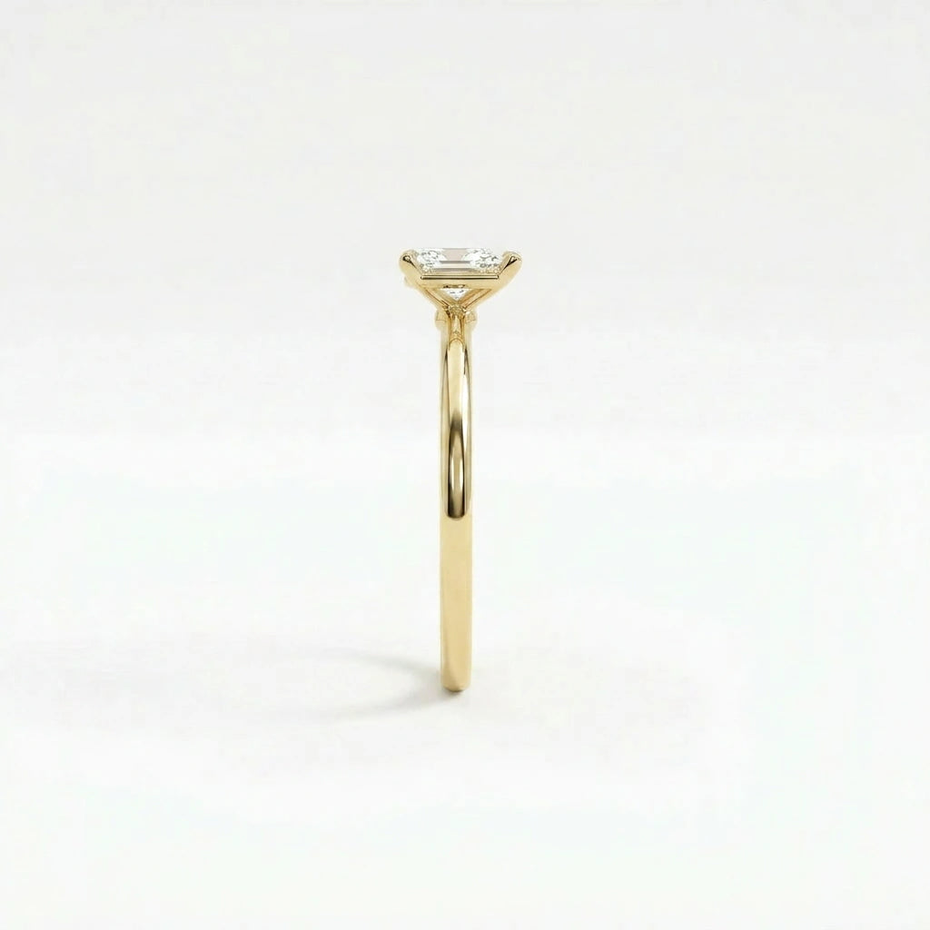 Side profile of pear solitaire ultra thin engagement ring in solid 14K yellow gold with lab-grown diamond