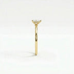 Side profile of pear solitaire ultra thin engagement ring in solid 14K yellow gold with lab-grown diamond