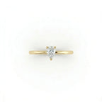 Top view of pear solitaire ultra thin engagement ring in solid 14K yellow gold