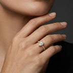 Woman wearing a pear ultra thin pavé engagement ring in solid 14K yellow gold