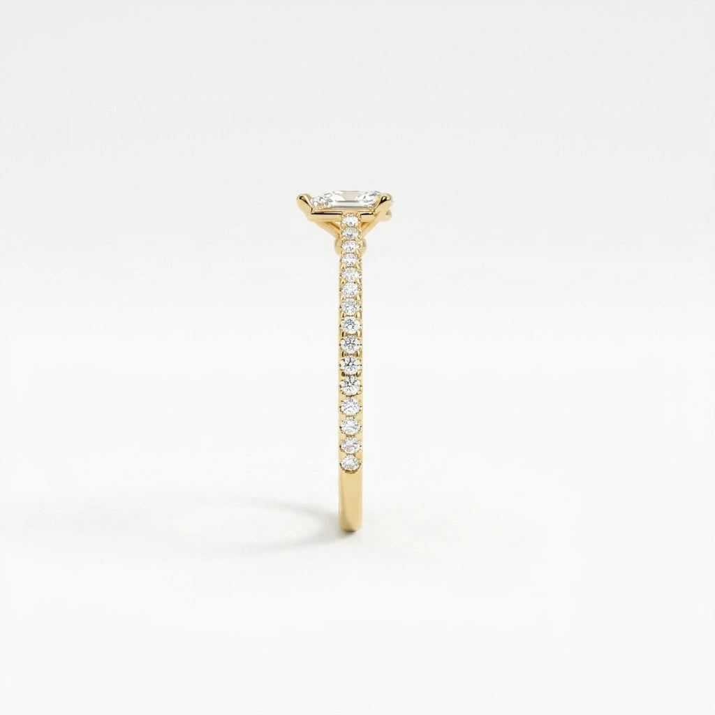 Side profile of pear ultra thin pavé engagement ring with lab-grown diamond and cathedral setting