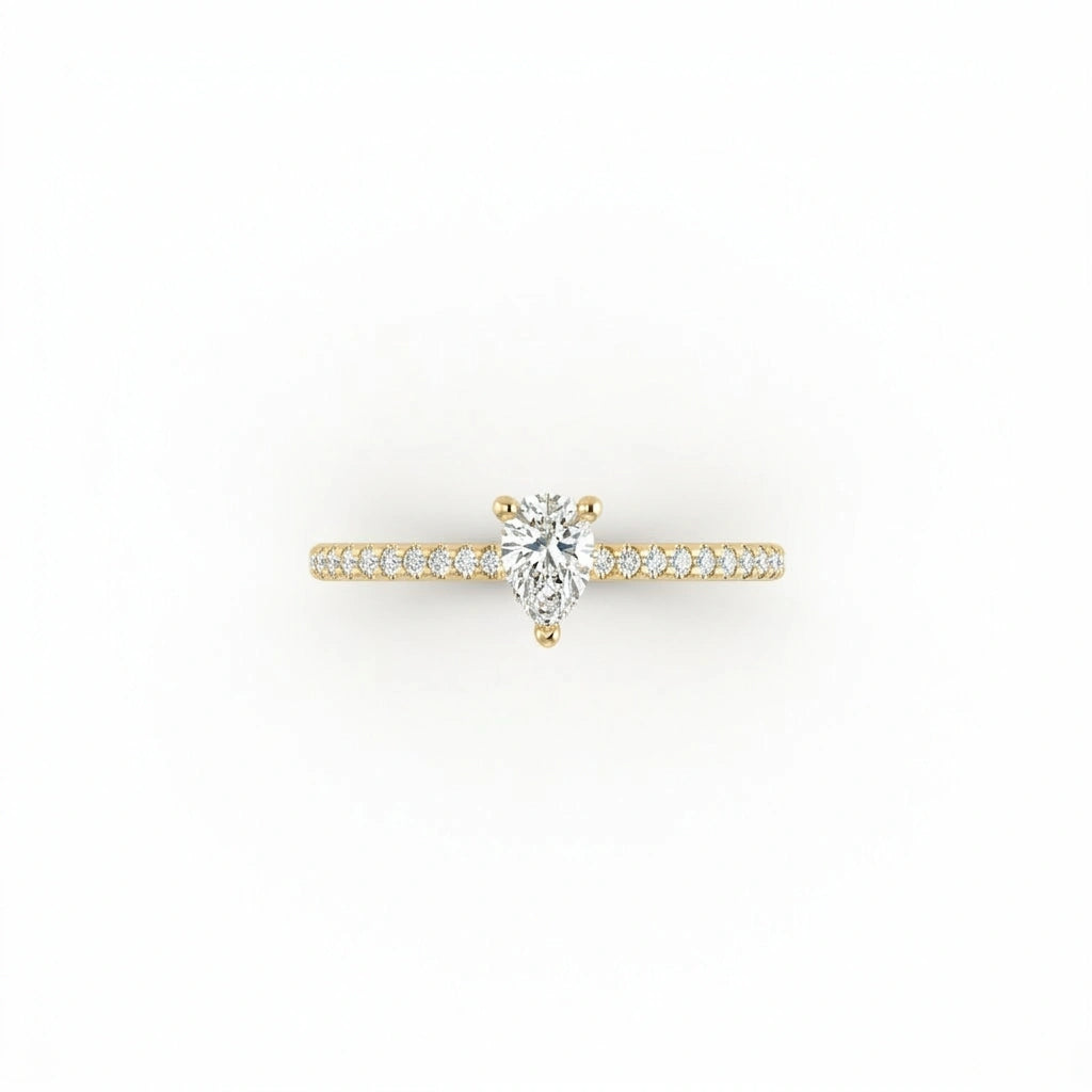 Top view of pear ultra thin pavé engagement ring in solid 14K yellow gold with lab-grown diamond