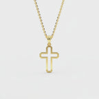 Woman wearing 14K gold minimalist outline cross pendant necklace at collarbone