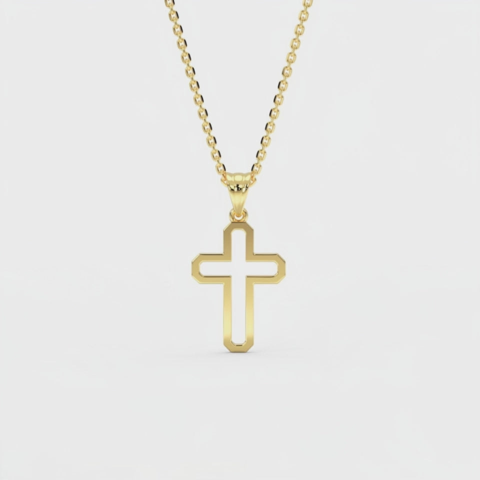 Woman wearing 14K gold minimalist outline cross pendant necklace at collarbone