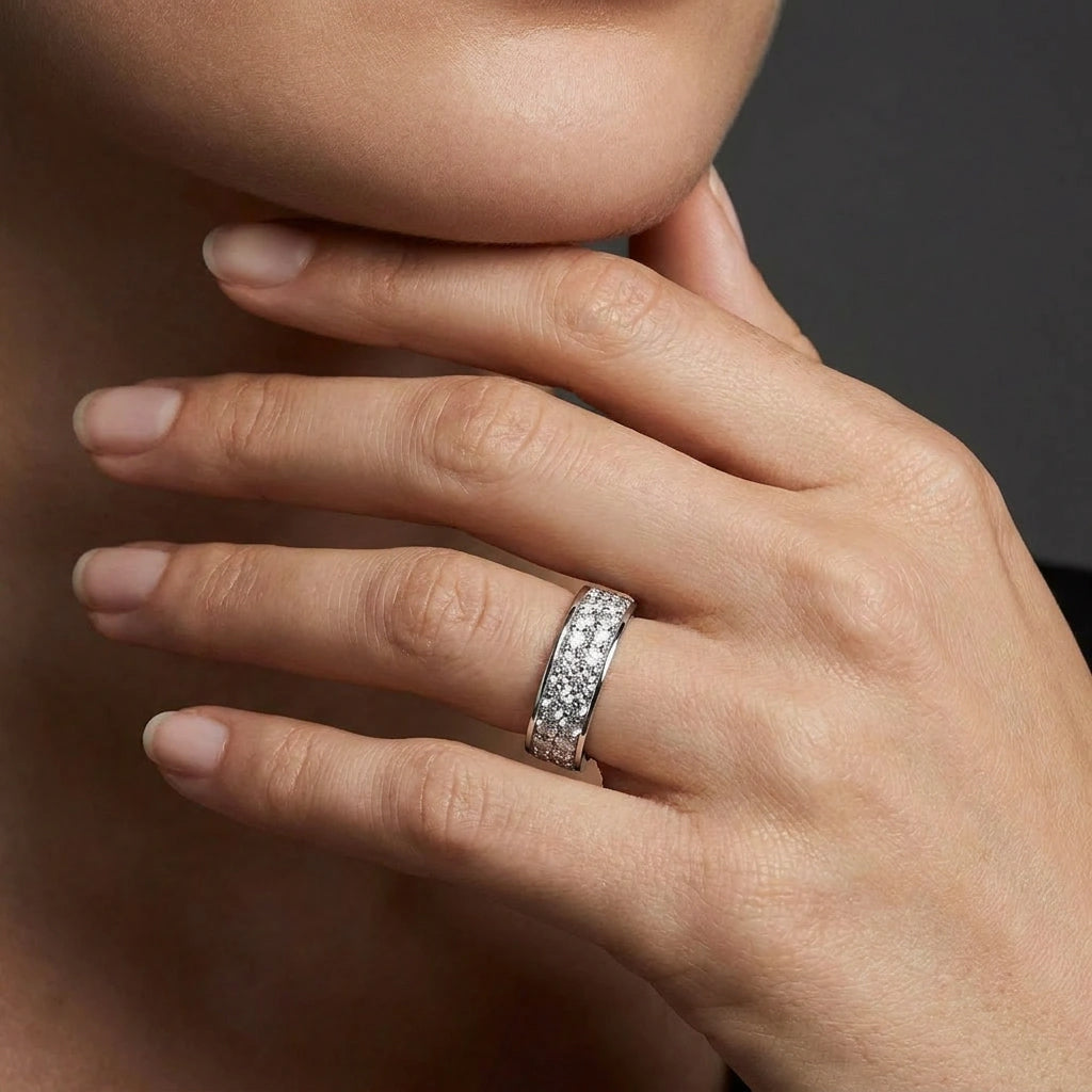 Woman wearing radiant eternity double row diamond ring in white gold on hand