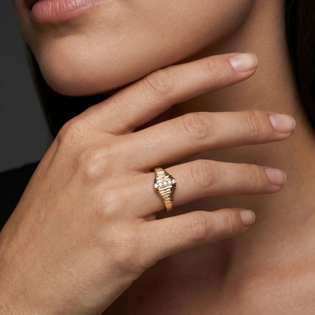 Ribbed lab-grown diamond signet ring in 14K yellow gold worn on hand, lifestyle shot