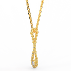 Side view of rope drop diamond pendant showing sculptural gold design