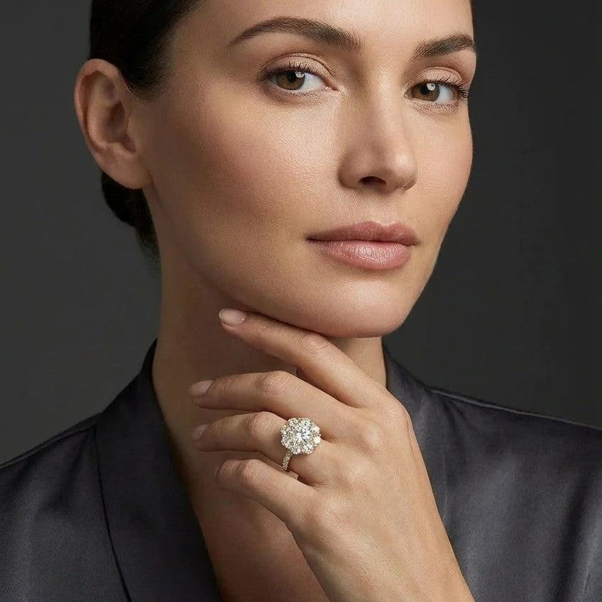 Woman wearing round diamond halo engagement ring with pavé band - elegant portrait lifestyle photo