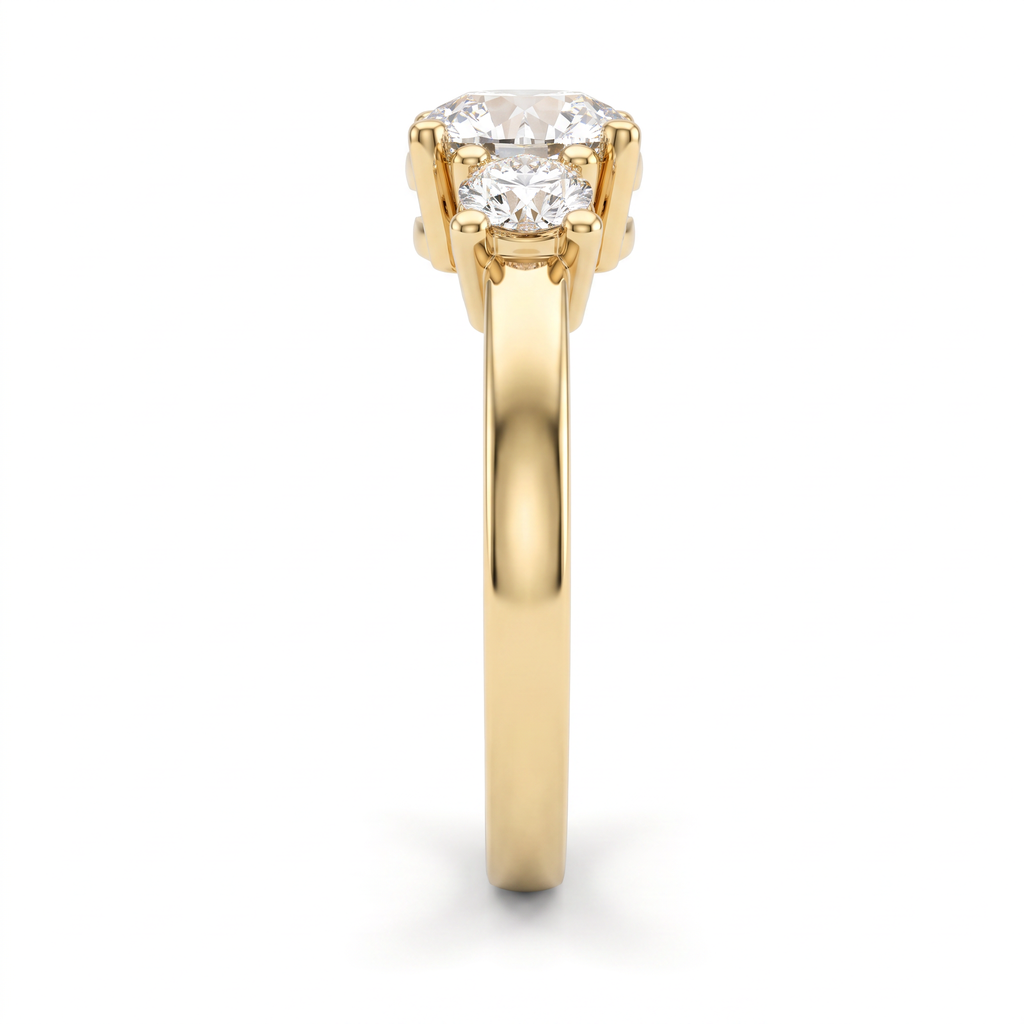 Side profile of round three-stone engagement ring in 14K yellow gold showing setting height and tapered band