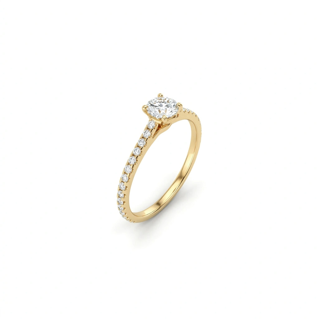Angled view of round ultra thin pavé engagement ring in solid 14K yellow gold
