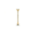 Side profile of round ultra thin pavé engagement ring in solid 14K yellow gold