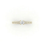 Top view of round ultra thin pavé engagement ring with lab-grown diamond in 14K yellow gold