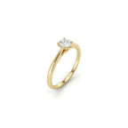 Angled view of round ultra thin solitaire engagement ring in solid 14K yellow gold