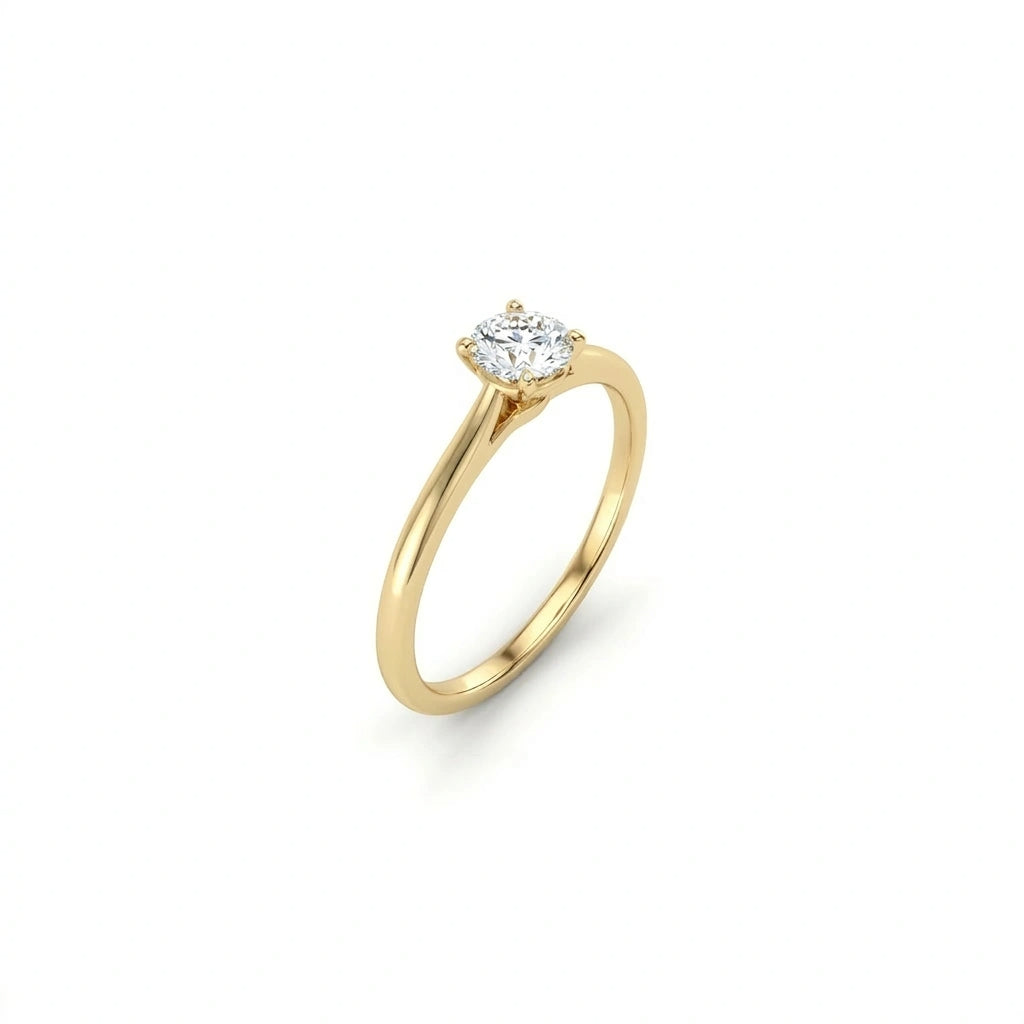 Angled view of round ultra thin solitaire engagement ring in solid 14K yellow gold