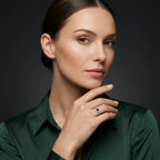 Sapphire twisted rope three-stone ring on hand - lifestyle photo showing blue sapphire brilliance