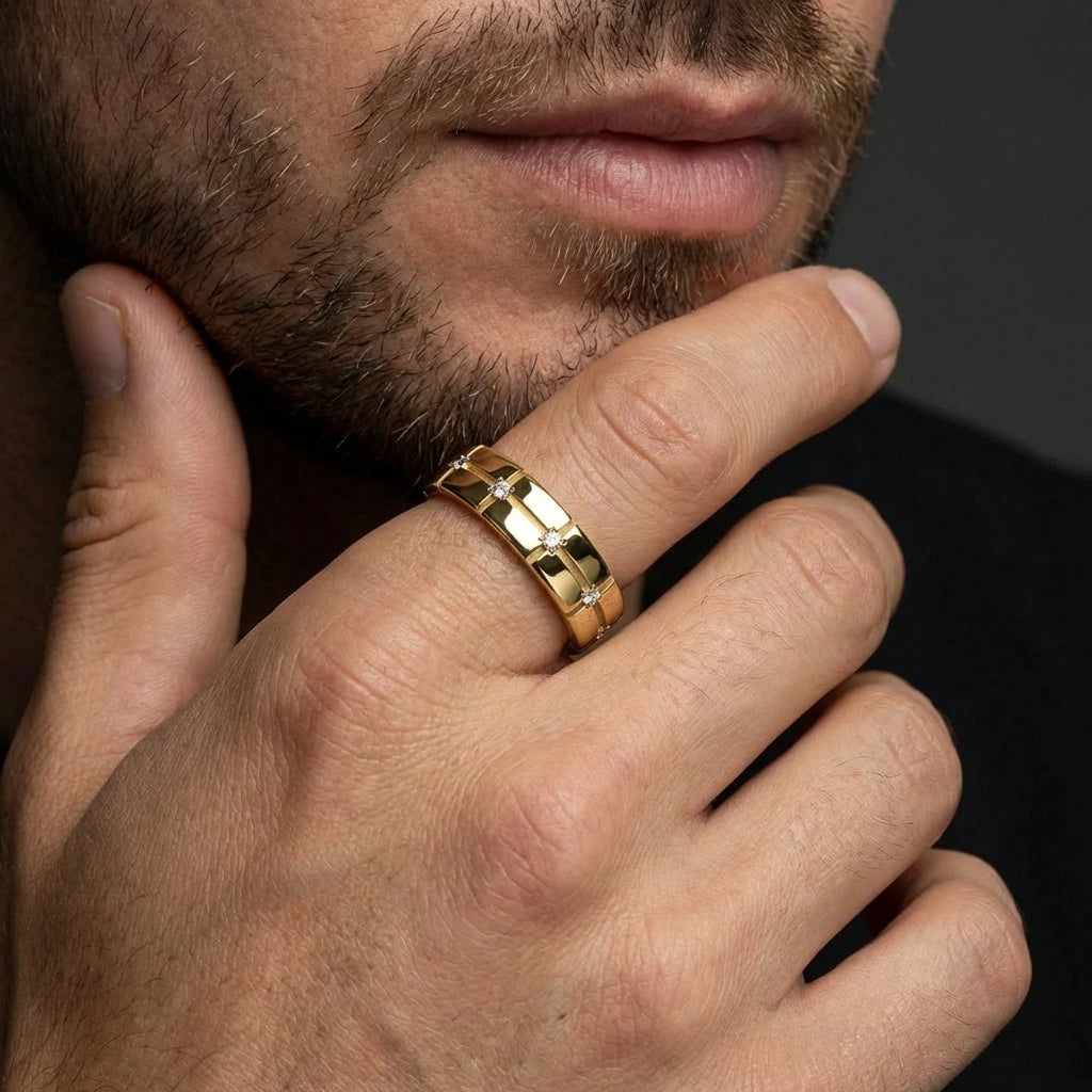 Stratus Grid Diamond Band in 14K yellow gold - close-up on male hand showing commanding presence and diamond sparkle.