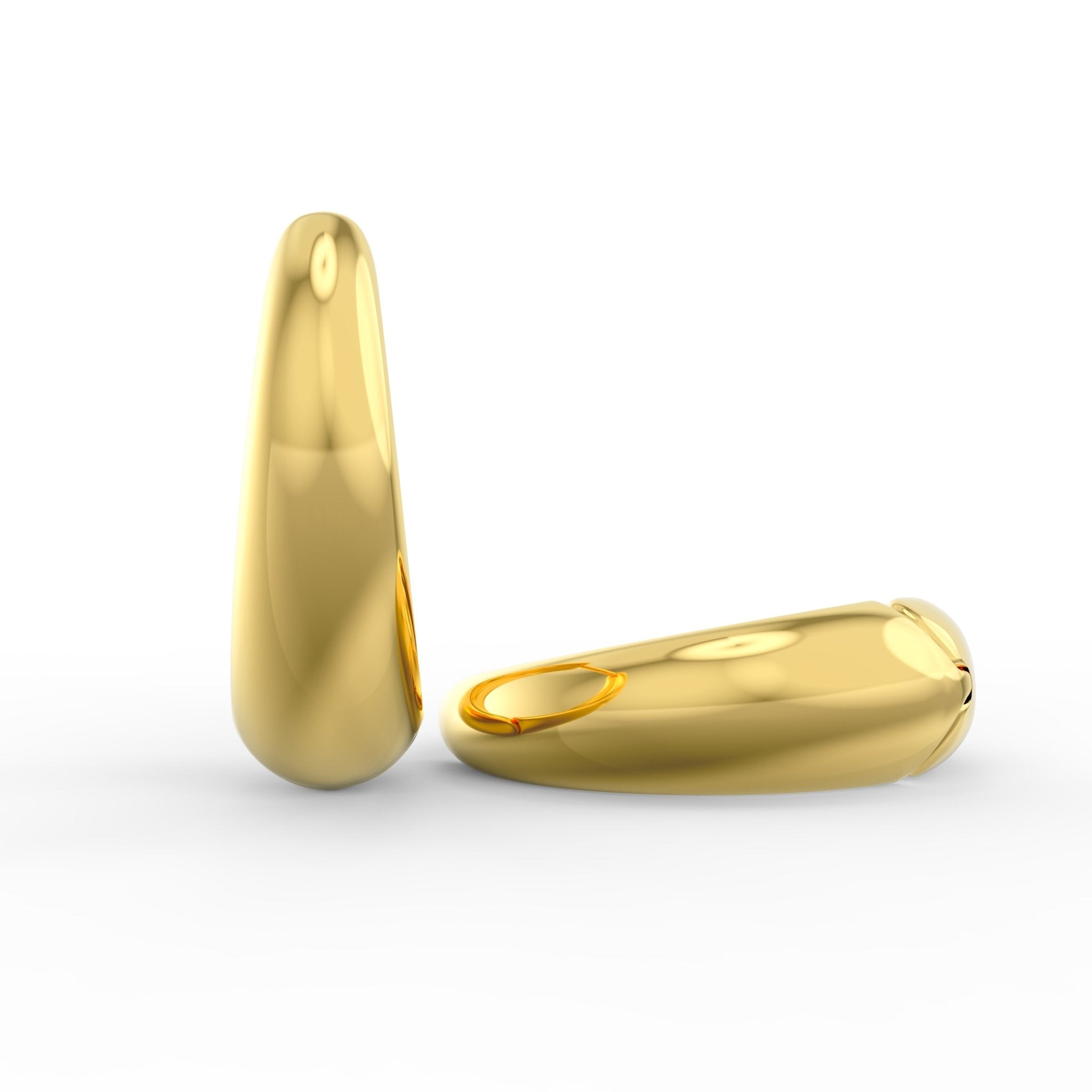 Front view of tapered chunky huggie hoops in solid 14K gold showing tapered width and bold silhouette.