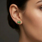 Tauren emerald line stud earrings in solid gold with horizontal row of green gemstones in modern circular design