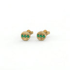 Tauren emerald line stud earrings in 14k yellow gold featuring horizontal emerald row set in polished round frame