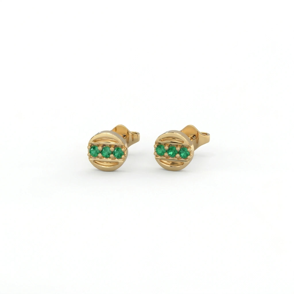 Tauren emerald line stud earrings in 14k yellow gold featuring horizontal emerald row set in polished round frame