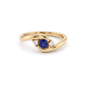 Three-stone bypass ring with a Lab-Created Blue Sapphire between two Lab-Grown Diamonds in 14K yellow gold