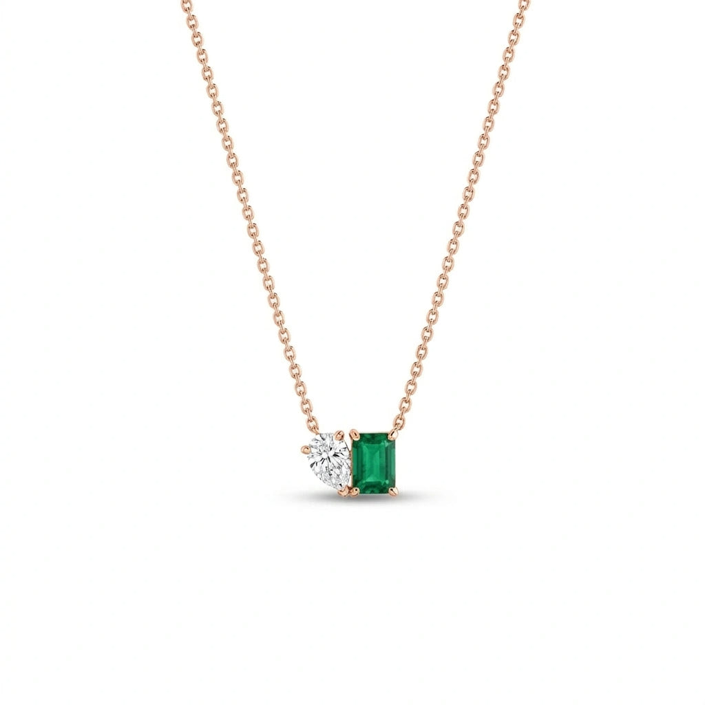 Minimalist pear diamond and emerald necklace in 14k rose gold